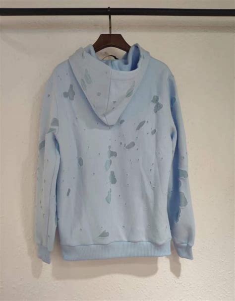 givenchy hoodie light blue ripped|givenchy hoodie with holes.